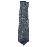 Liberty bird and flower design on a blue background silk tie