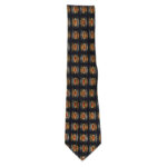 Yves Saint Laurent silk tie with a dark blue background and an abstract design in yellow, red and grey.