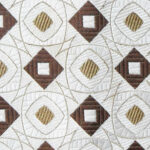 Vintage Christian Dior textured silk tie with a cream, dark brown and gold design