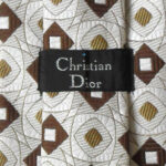 Vintage Christian Dior textured silk tie with a cream, dark brown and gold design