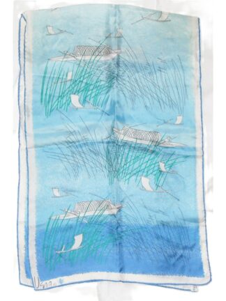 Vera long silk scarf with a blue background and a design of fishnig boats