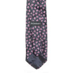 ves Saint LAlurent silk tie with a navy background and a small mauve leaf design